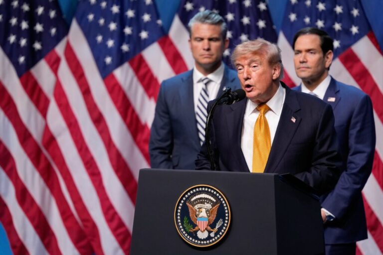 President Donald Trump speaks during a media conference, flanked by Defense Secretary Pete Hegseth and Secretary of State Marco Rubio.