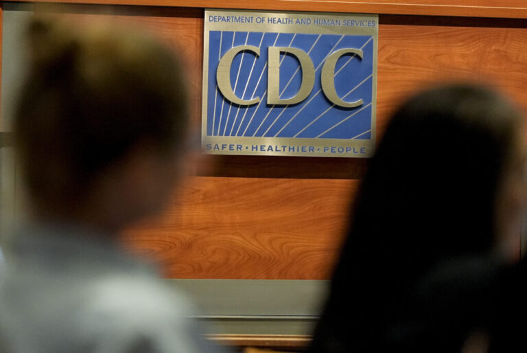 Participants listen during a meeting at the CDC.