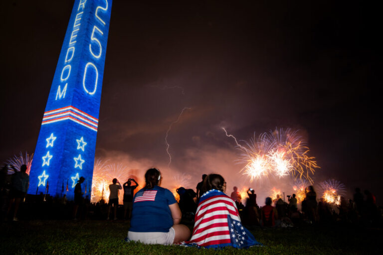 Fireworks and lightning over the National Mall during an Independence Day event honoring the nation's 250th anniversary