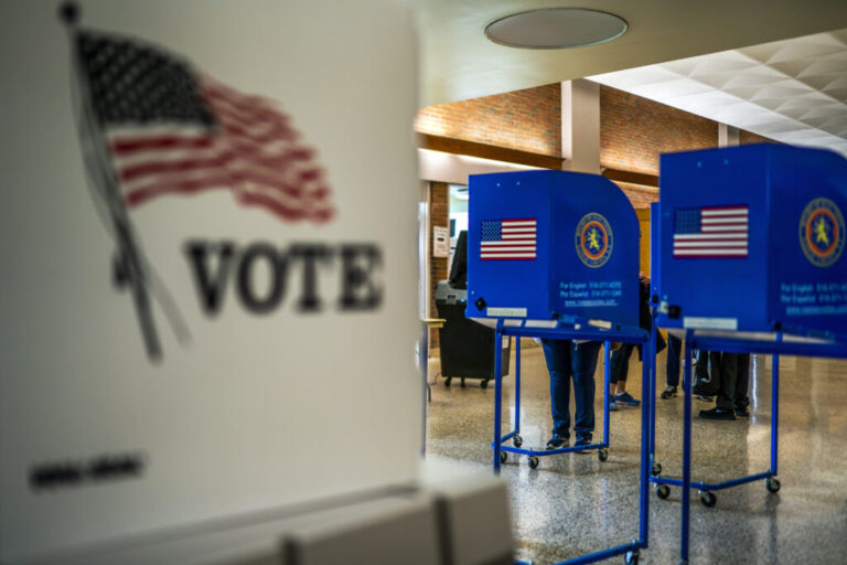 A woman marks her ballot inside of a voting center in Long Island.