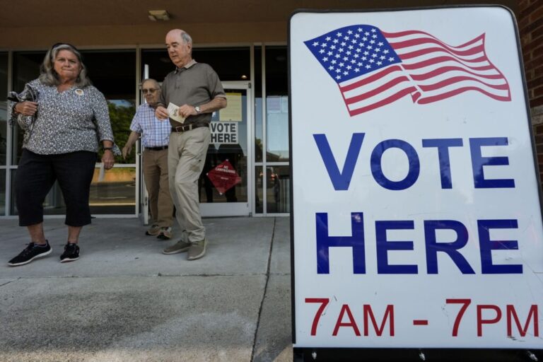 Voters depart a polling place in Kennesaw, GA.