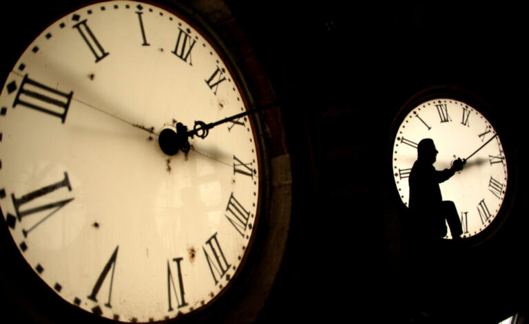 Worker inspects clock face