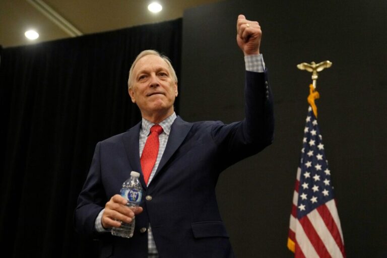 Andy Biggs gives a thumbs up to supporters at a campaign event.