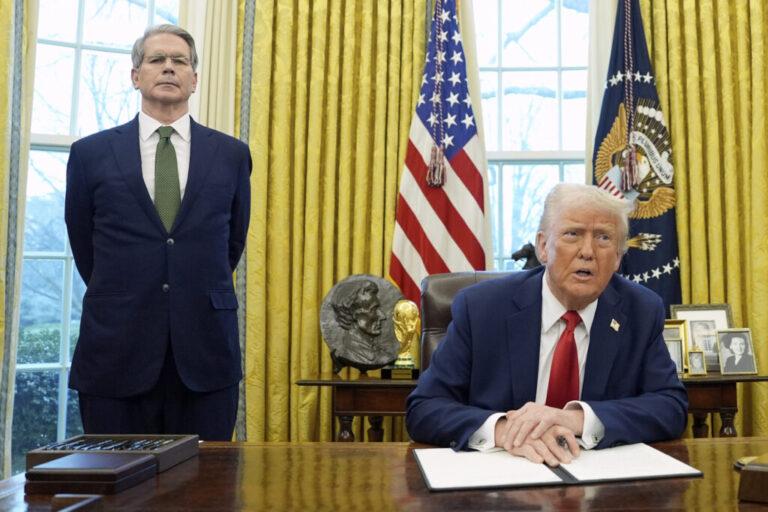 President Donald Trump speaks as Treasury Secretary Scott Bessent listens