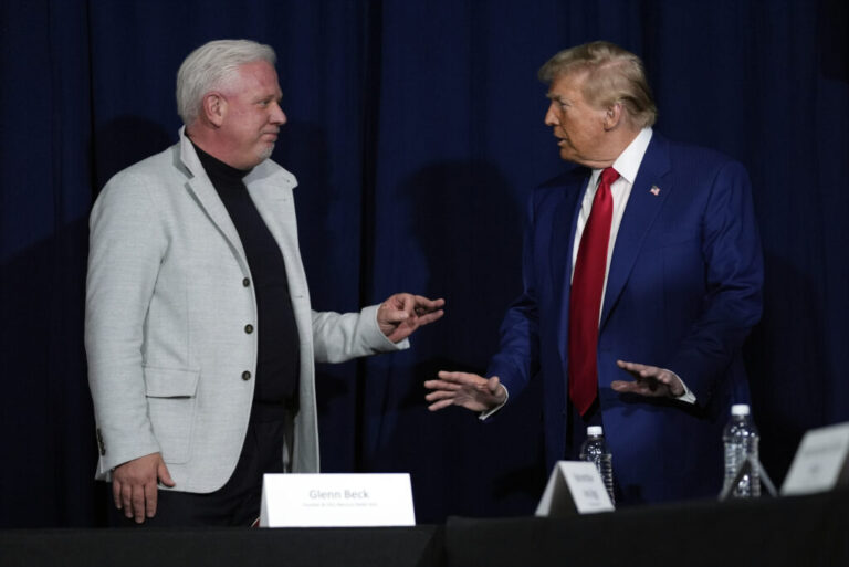 President Donald Trump talks with conservative commentator Glenn Beck.
