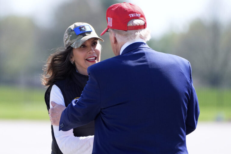 President Donald Trump greets Michigan Gov. Gretchen Whitmer